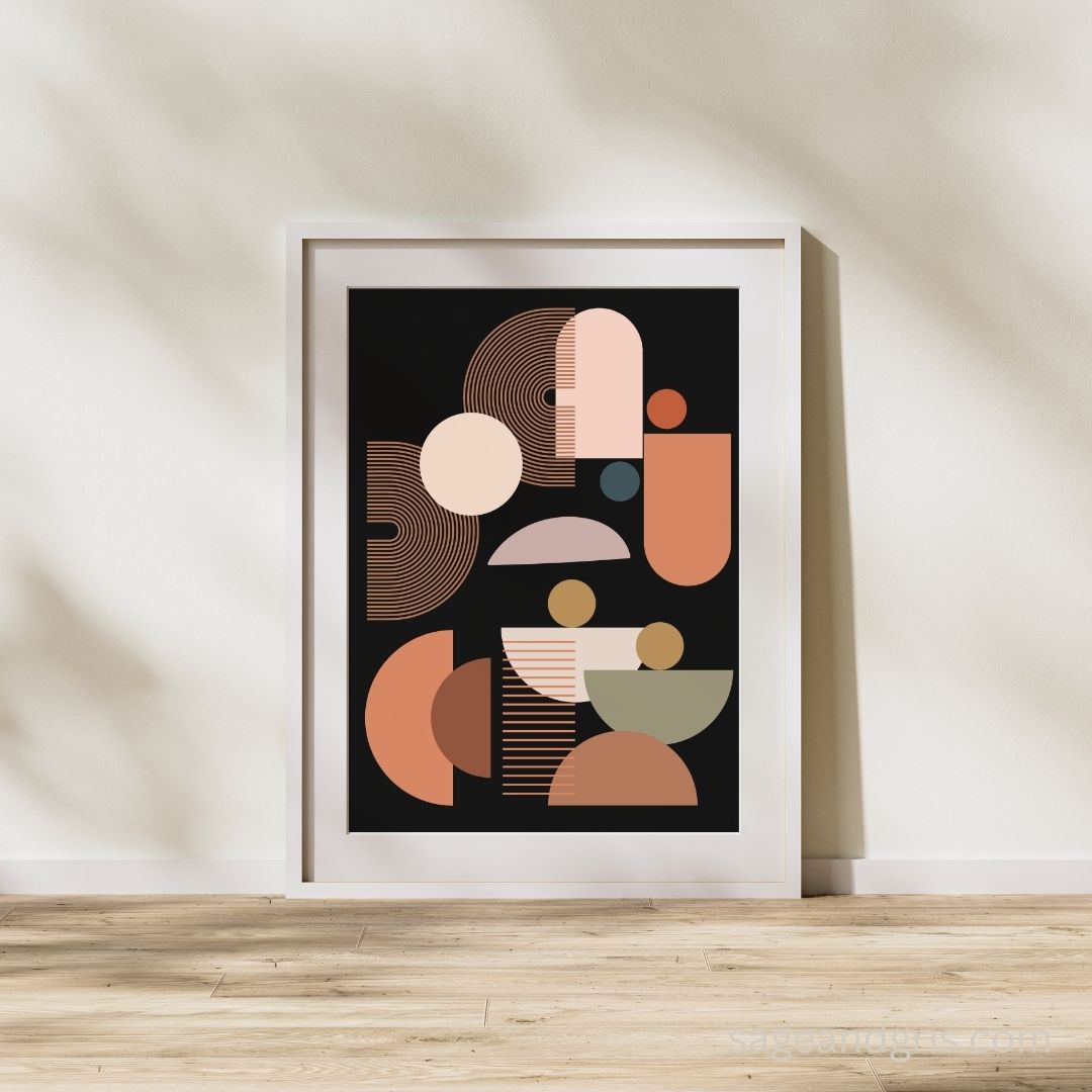 Framed bohemian art print with geometric shapes in a simple fame against a neutral wall.